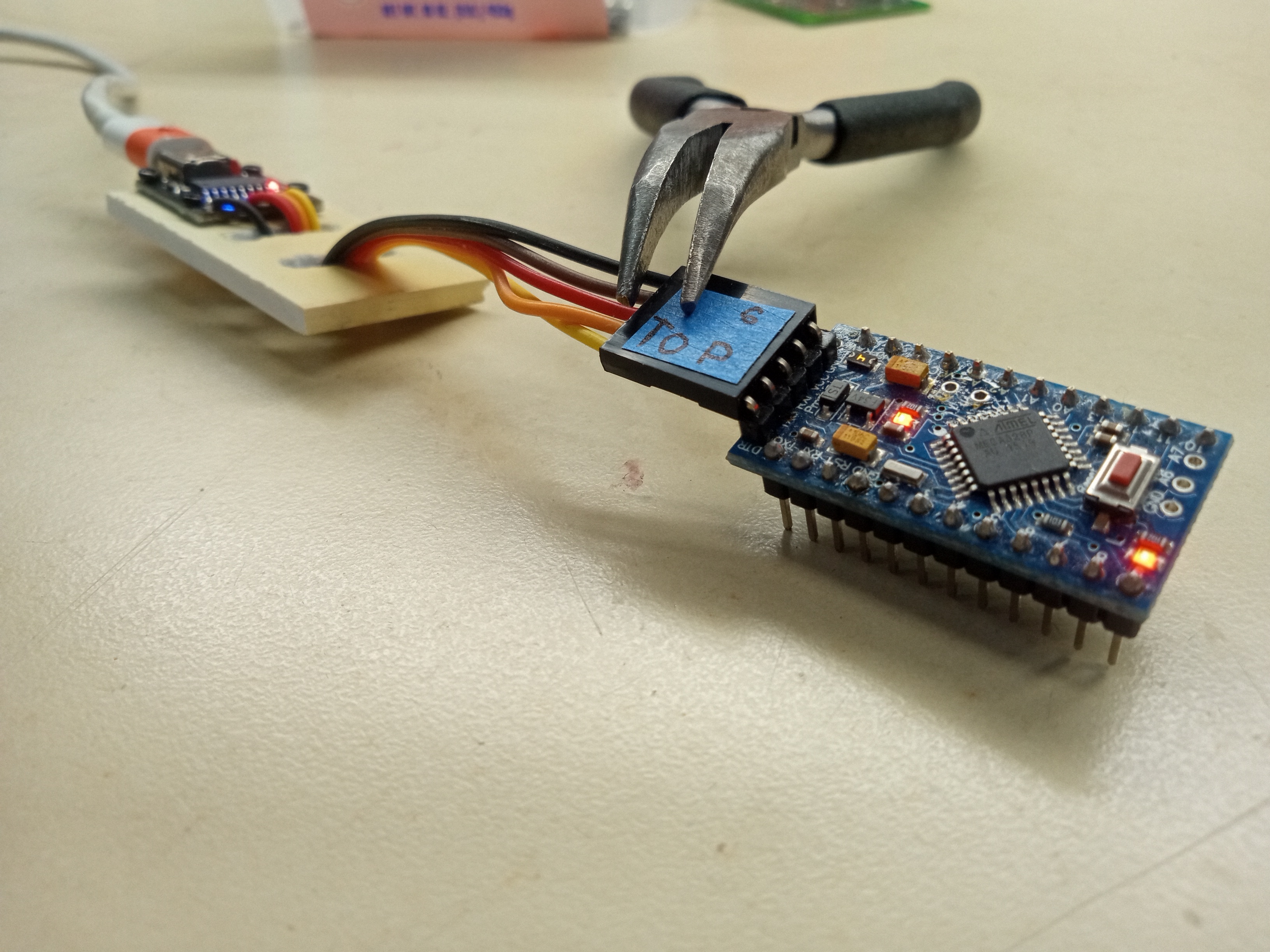 Close view of a turned-on USB-C to TTL cable converter.